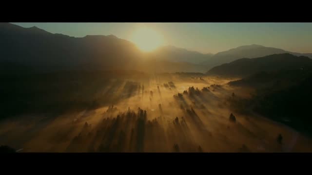 Sunrise over a misty valley